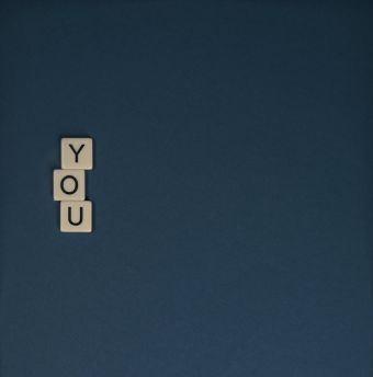 Scrabble Tiles on Blue Surface