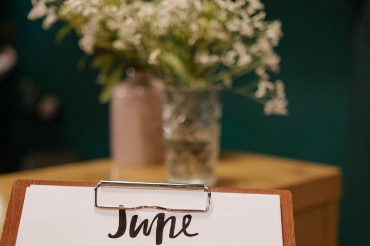 Person Holding a Calendar and Clipboard